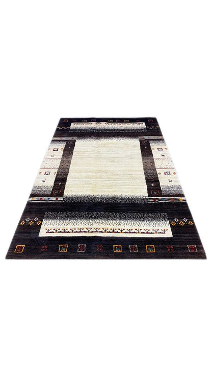 Rectangular rug with a light center, black border, and colorful ornaments along the edges