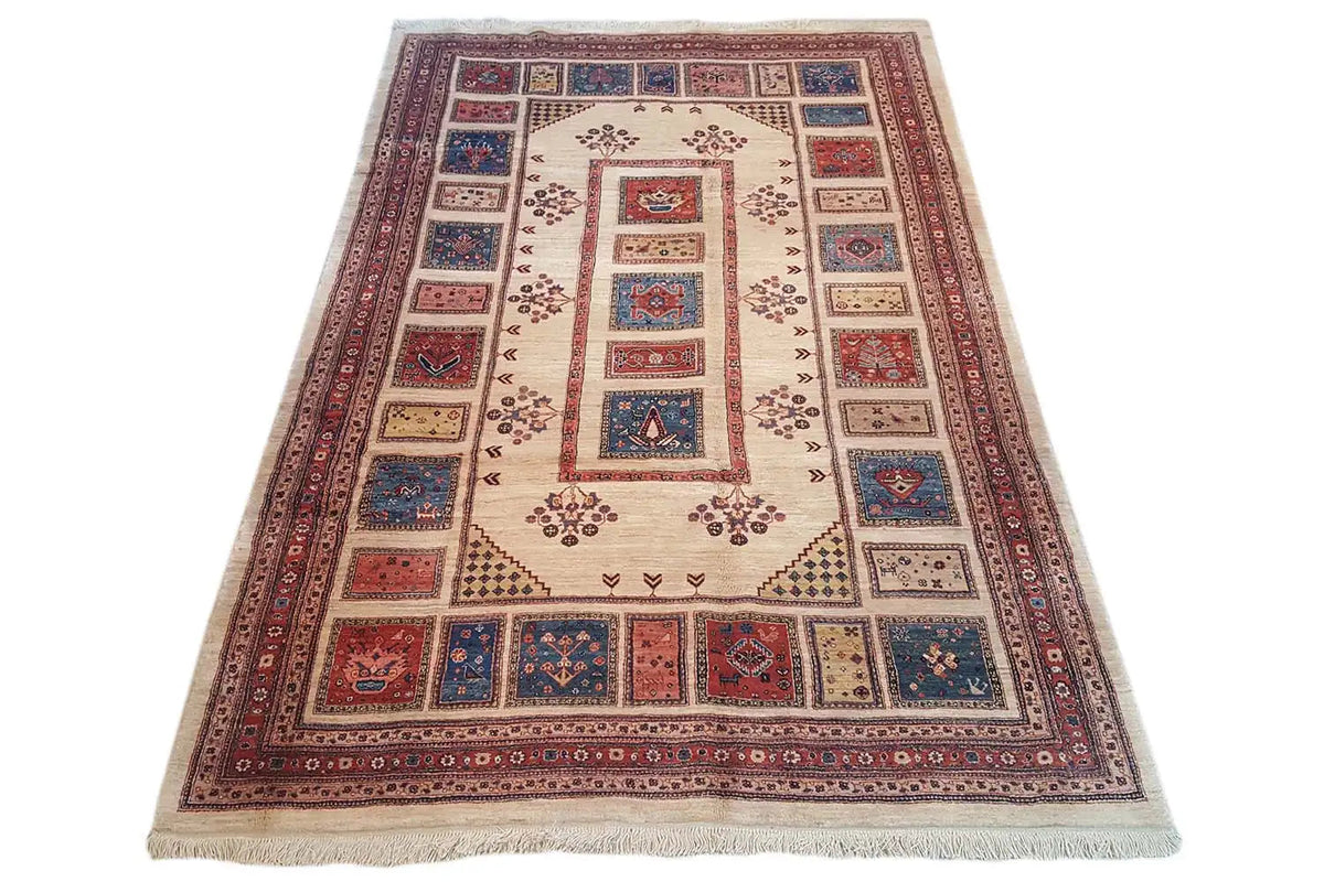 Rug with a large central field and border featuring red, blue, and cream-colored motifs