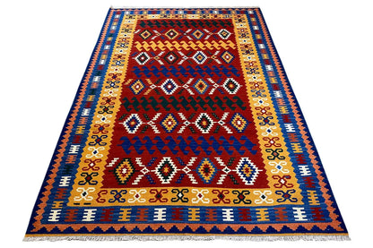 Kilim rug with a red center, blue border, and short fringes