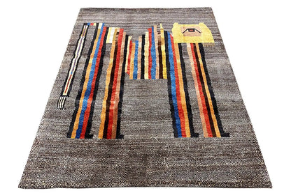 Low-pile rug, photographed from a trapezoidal angle: gray background with broad multicolored stripes.
