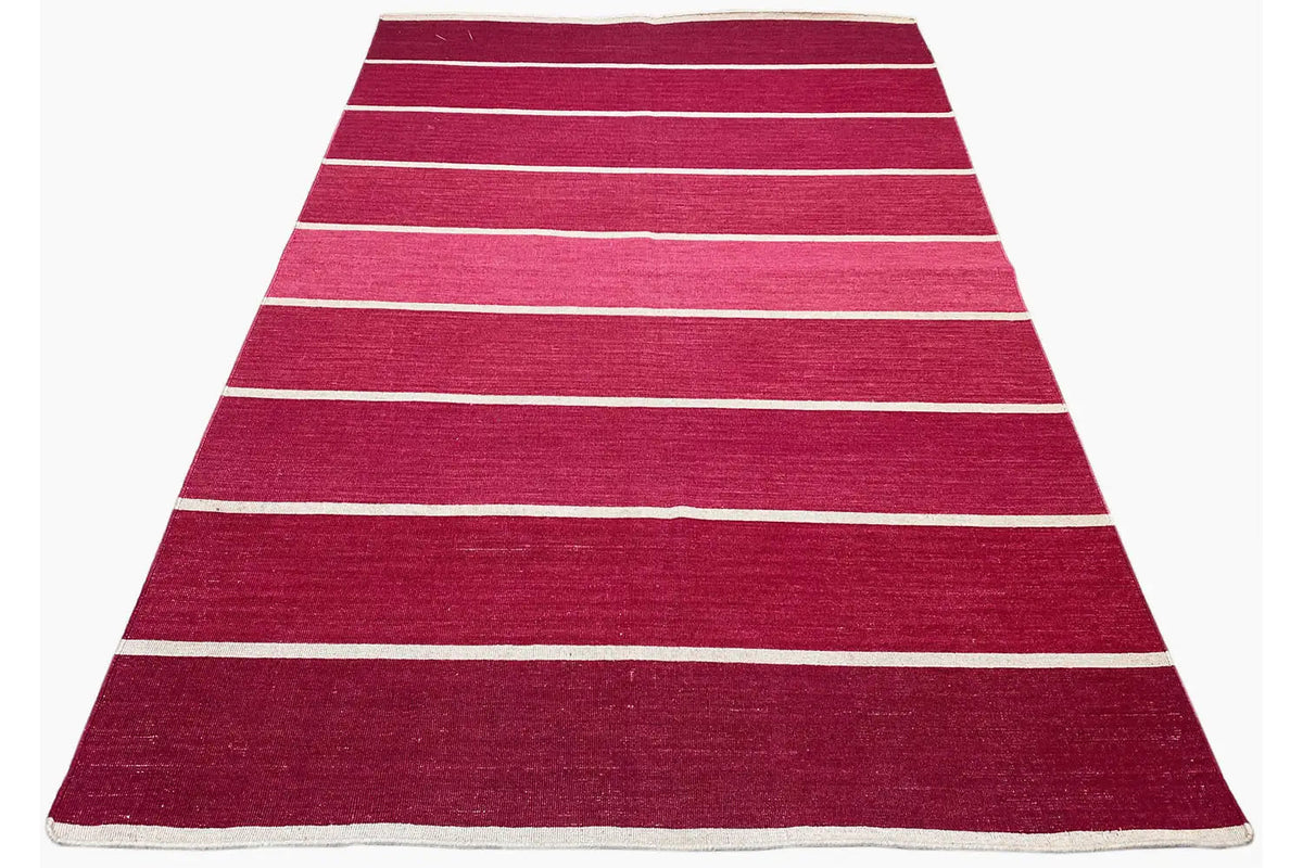 Striped kilim rug in red with light horizontal stripes and a woven border