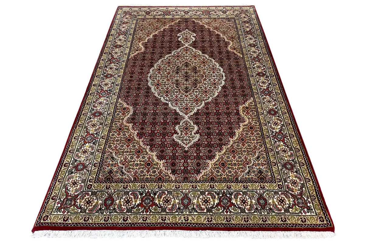 Indo Tabriz rug, brown central field with medallion, surrounding ornamental border