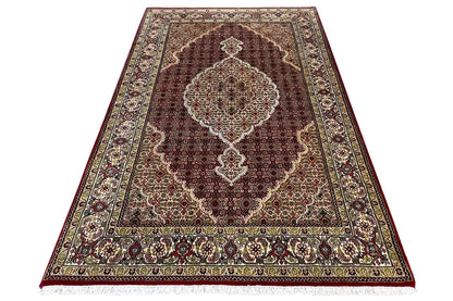 Indo Tabriz rug, brown central field with medallion, surrounding ornamental border