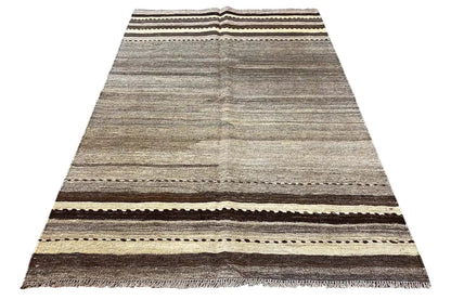Kilim rug in portrait orientation: gray striped pattern with brown, beige, and black borders