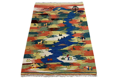 Kilim Qashqai rug with a multicolored landscape motif and fringes along the edge