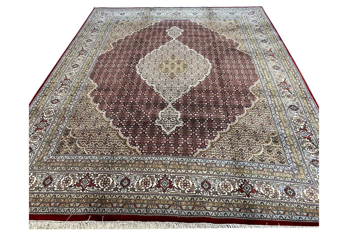 Indo Tabriz rug viewed from above, large medallion pattern in brown and cream