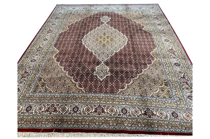 Indo Tabriz rug viewed from above, large medallion pattern in brown and cream