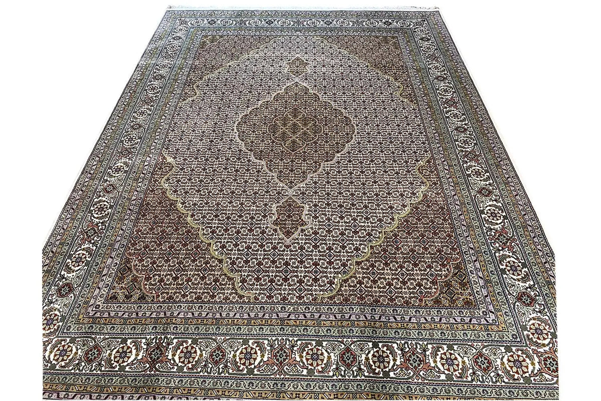 Indo Tabriz rug, rectangular; geometric pattern in brown and blue with border