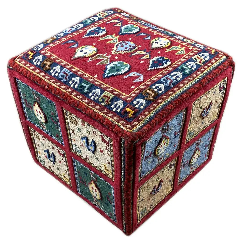 Carpet cube: square carpet with a red top and side panels in blue, beige, and green