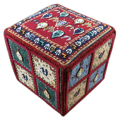 Carpet cube: square carpet with a red top and side panels in blue, beige, and green