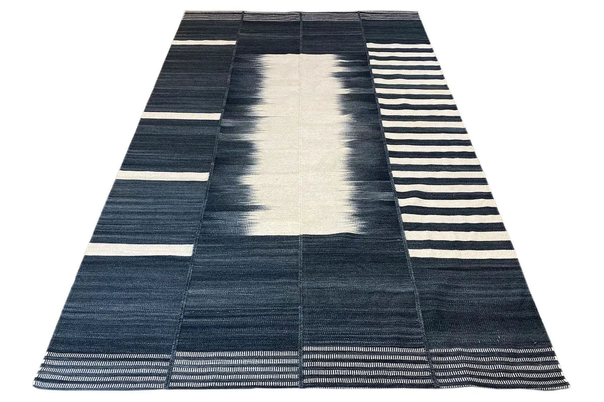 Modern kilim in a triangular design with striped borders in dark blue and white