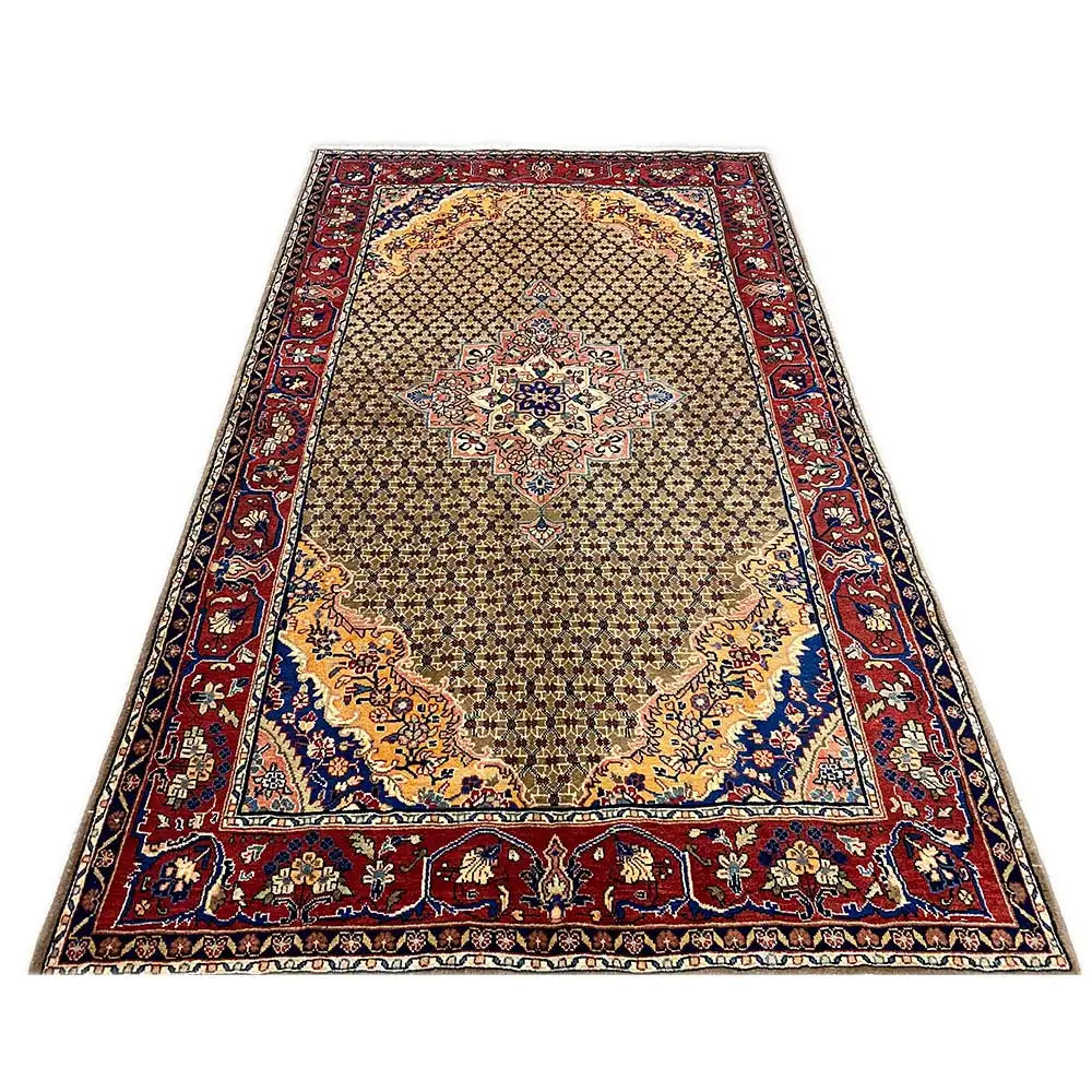 Rectangular Hamadan rug with a central medallion and border in red, blue, and beige