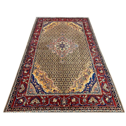 Rectangular Hamadan rug with a central medallion and border in red, blue, and beige