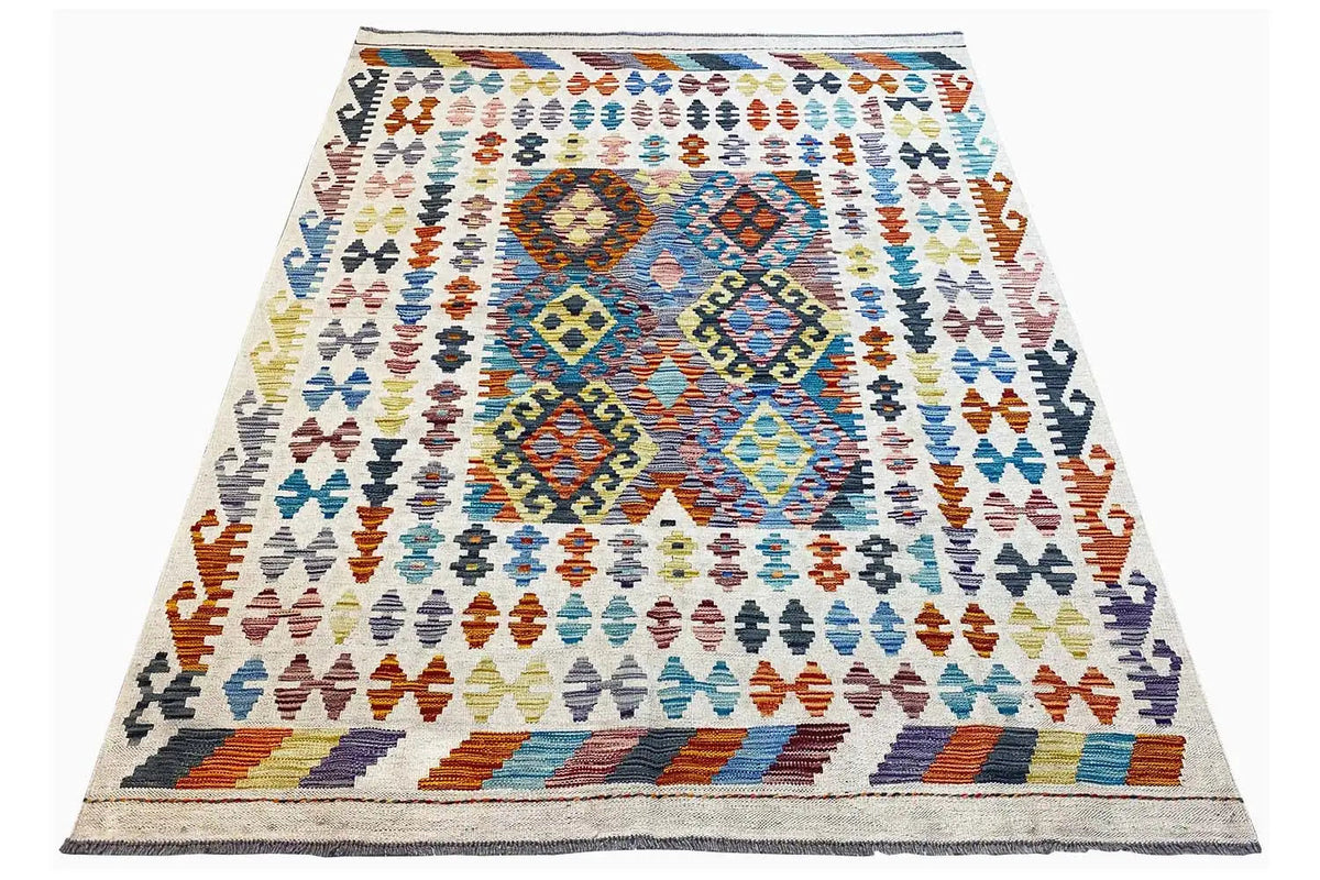 Afghan kilim rug, angled with colorful diamonds in the central area