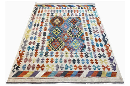 Afghan kilim rug, angled with colorful diamonds in the central area