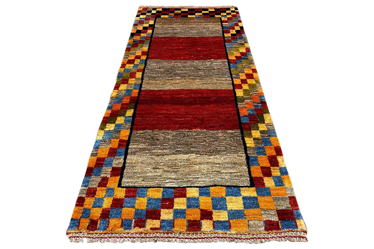 Gabbeh rug (190x83 cm), viewed from above: border with colorful squares and a central stripe in red and gray.