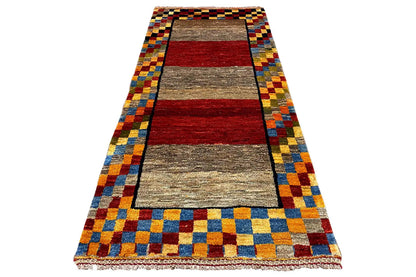 Gabbeh rug (190x83 cm), viewed from above: border with colorful squares and a central stripe in red and gray.