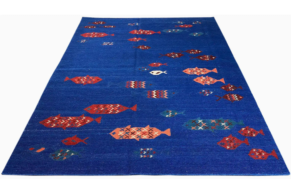Blue carpet with multicolored fish/diamond motifs, overall view