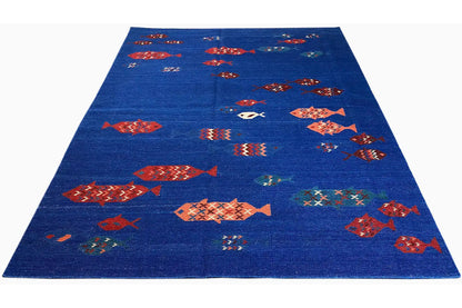 Blue carpet with multicolored fish/diamond motifs, overall view