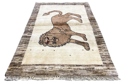 Gabbeh rug with lion motif, light beige and brown, framed, fringed