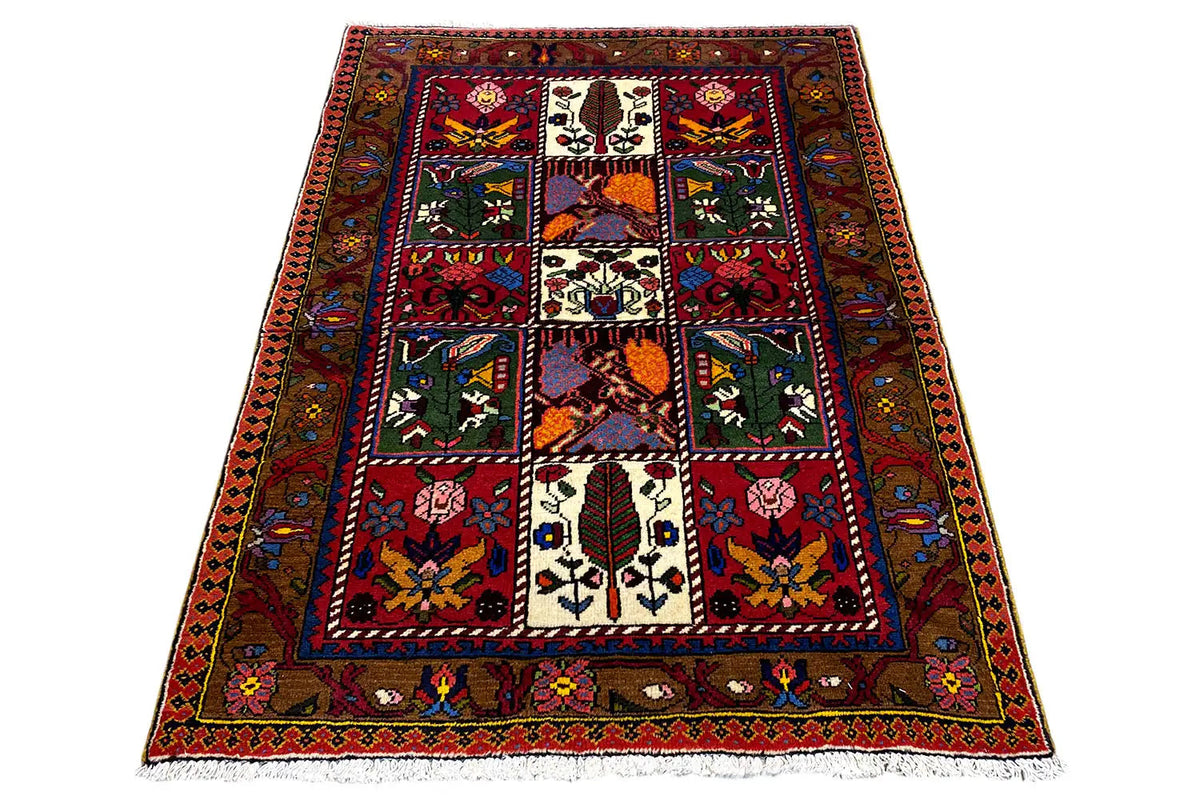 Bakhtiari rug, spread out rectangularly; central pattern and border edging