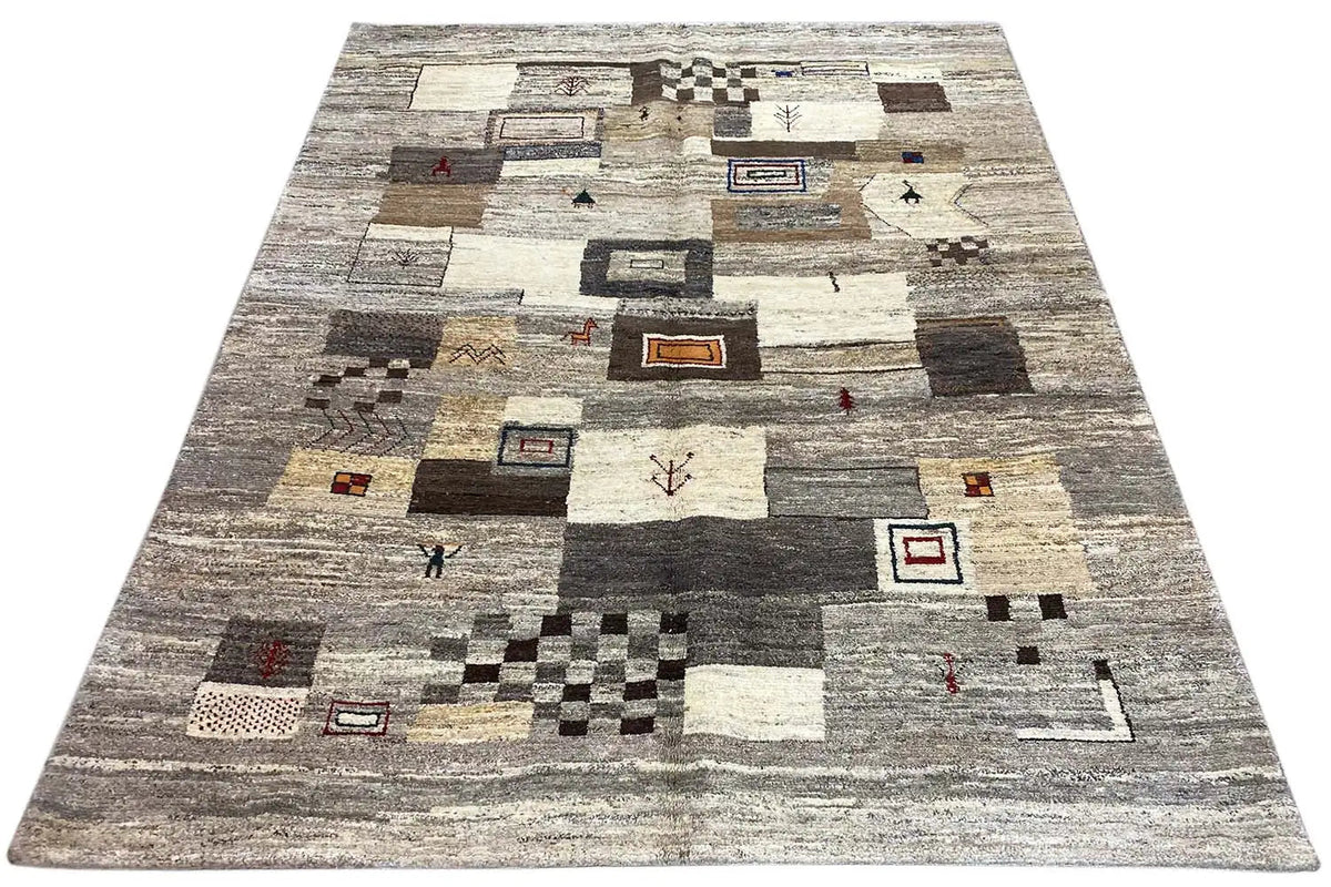 Rectangular rug with an abstract tile pattern in gray, beige, and dark areas