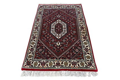 Bidjar rug (94×62 cm): Elegant medallion pattern, red pile, with fringes all around