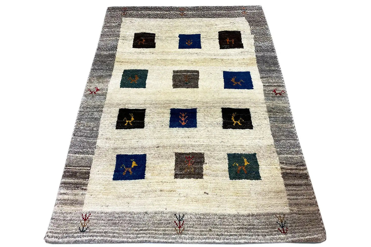 Gabbeh rug (117x85 cm) with a square pattern in blue, black, gray, and cream
