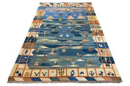Rectangular kilim rug in blue with colorful borders and a row pattern