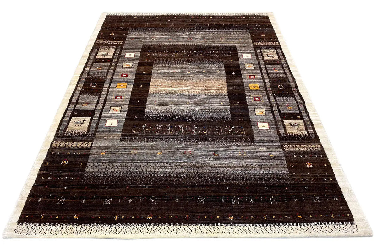 Gabbeh rug with a central medallion and border, dark brown and gray shading