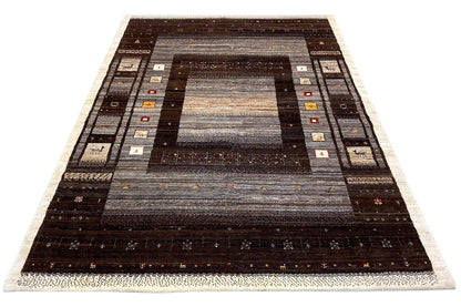 Gabbeh rug with a central medallion and border, dark brown and gray shading