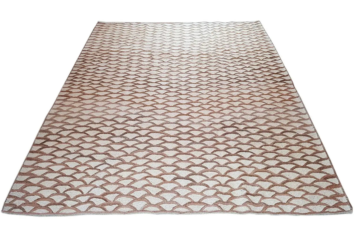 Rectangular rug with an even scale pattern in beige and brown