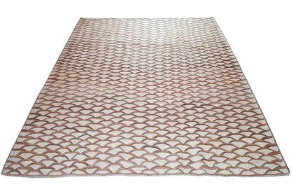 Rectangular rug with an even scale pattern in beige and brown