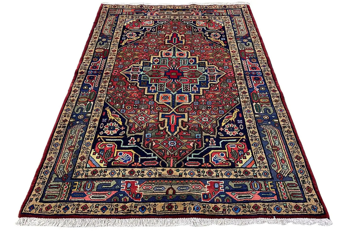 Rectangular Hamadan rug with a red central pattern and blue border