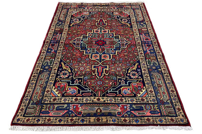 Rectangular Hamadan rug with a red central pattern and blue border