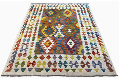 Afghan kilim with a large central motif and colorful border ornaments, rectangular