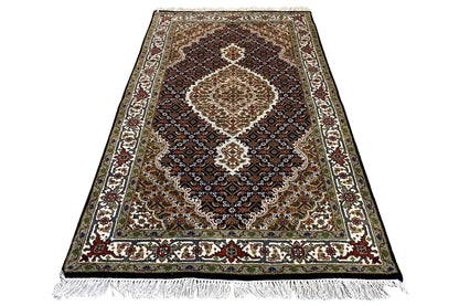 Indo Tabriz rug, brown-black background, central medallion, fringes