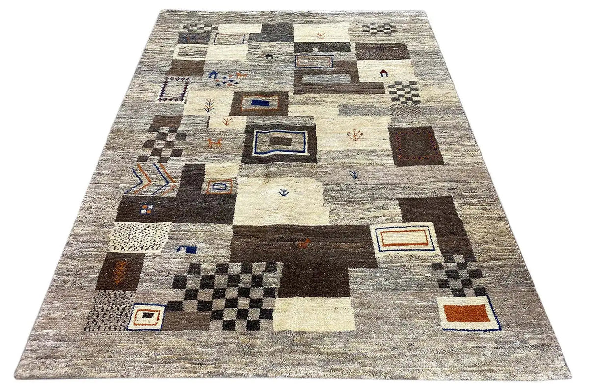 Gabbeh rug with abstract patchwork: beige/gray, black-brown blocks, blue and orange accents