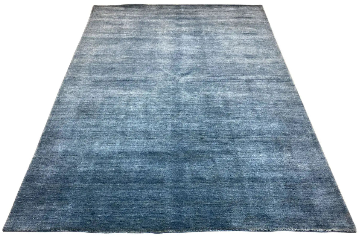 Blue Gabbeh rug with a subtle, uniform pattern