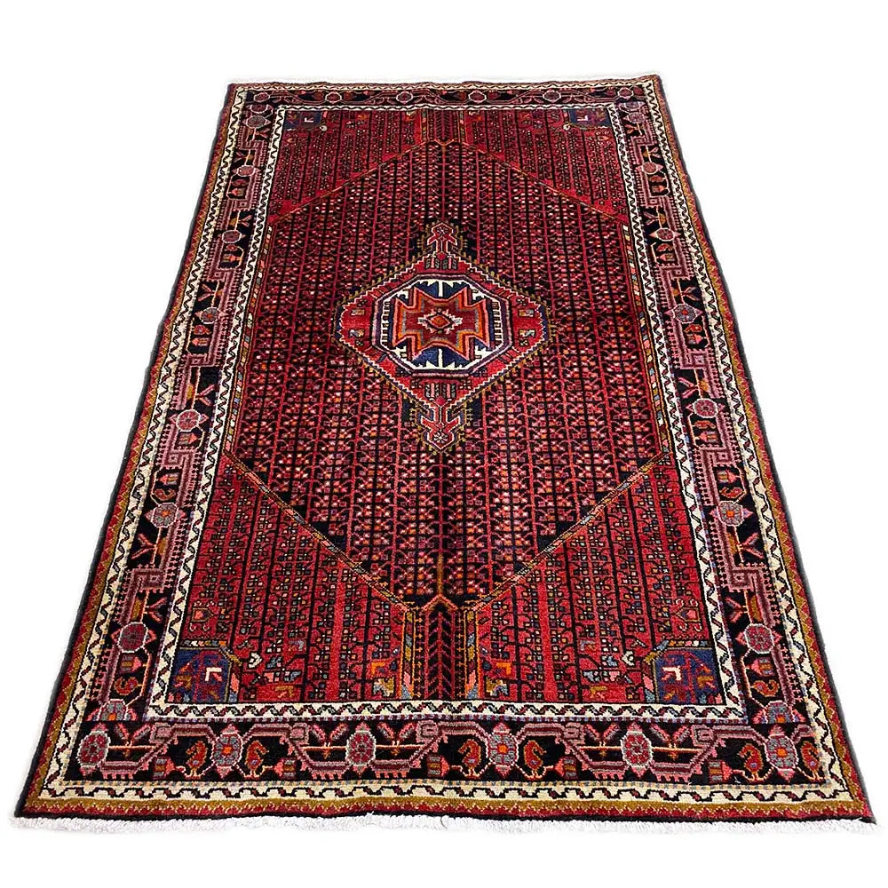 Rectangular Hamadan rug, red pile with a blue/white medallion and border motif