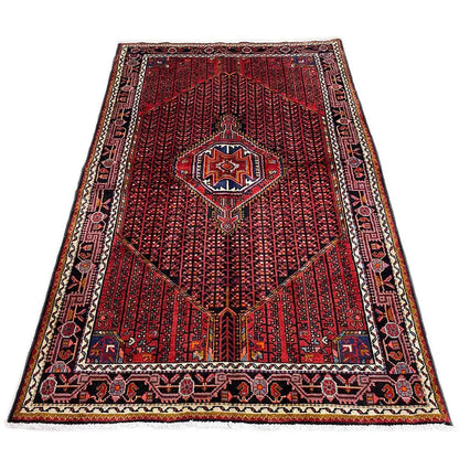 Rectangular Hamadan rug, red pile with a blue/white medallion and border motif