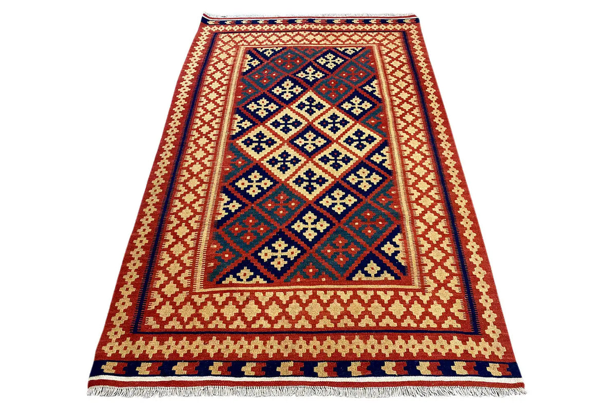 Folded kilim rug: large blue/red medallion framed by a yellowish-white border