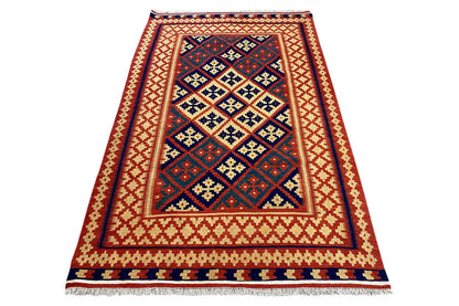 Folded kilim rug: large blue/red medallion framed by a yellowish-white border