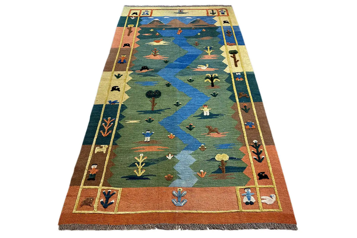 Large-format kilim rug with blue zigzag and landscape motifs, brown border
