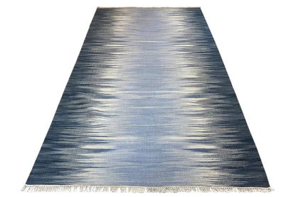 Ombre kilim dhurrie rug in dark blue to light gray, rectangular, with fringes