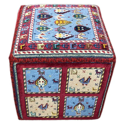 Carpet cube with a blue lid design and four pattern discs on the front