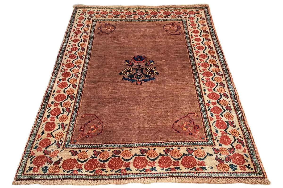 Brown oriental rug with medallion pattern, red ornamental border, and edging