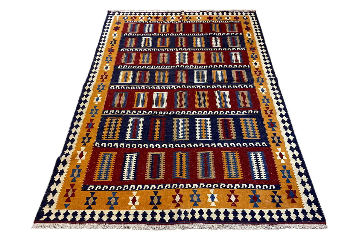 Oriental rug with an all-over pattern and border in blue, red, and yellow, rectangular