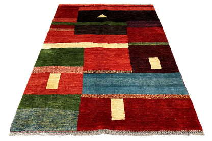 Gabbeh rug with stripes and squares in red, green, black, and blue