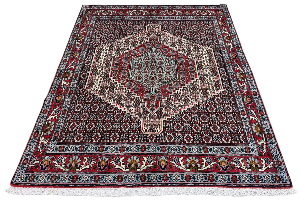 Hamadan rug with a large central pattern, surrounding border, and flat-woven edge